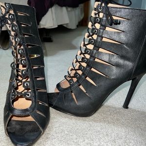 Black feaux leather peep toe tie up strappy heels